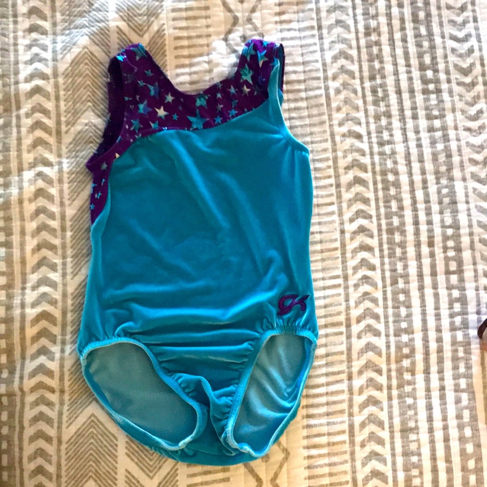 GK Elite gymnastics leotard. Blue & purple with metallic stars. Child L Usex
